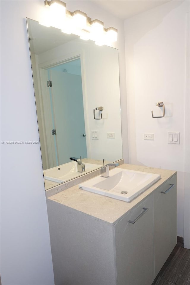 bathroom featuring vanity and hardwood / wood-style floors