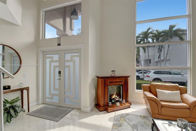 living room with a towering ceiling