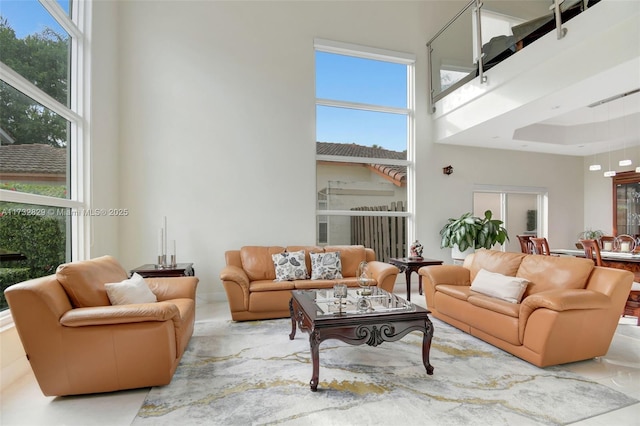 living room with a towering ceiling