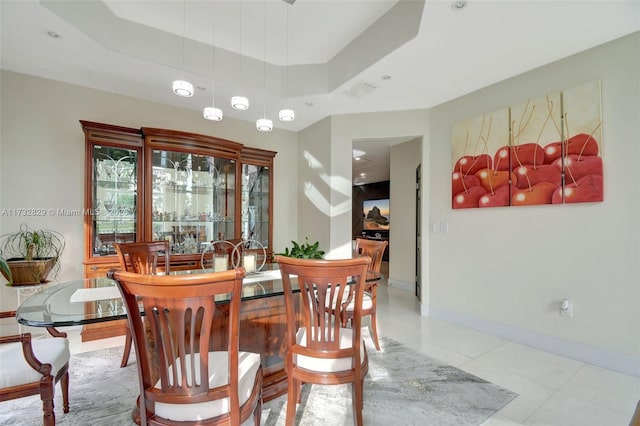 dining area with a high ceiling