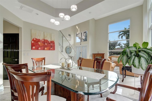 living room with french doors and light tile patterned floors