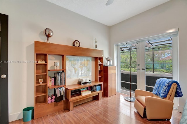 bedroom featuring hardwood / wood-style flooring, ceiling fan, and a closet