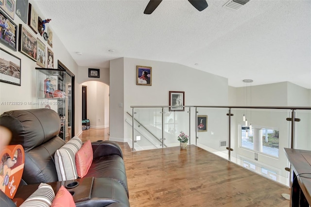 living room with a towering ceiling and tile patterned flooring