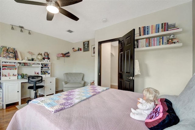 bedroom featuring ceiling fan and wood-type flooring