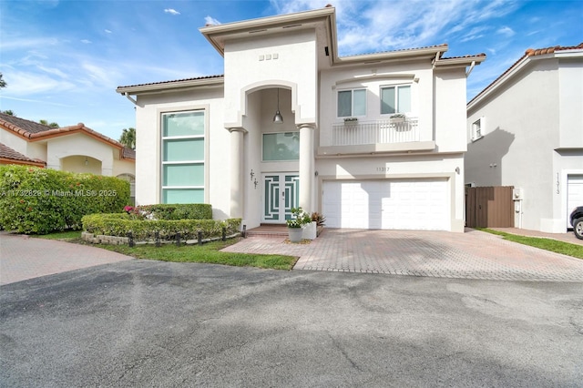 mediterranean / spanish house with a garage