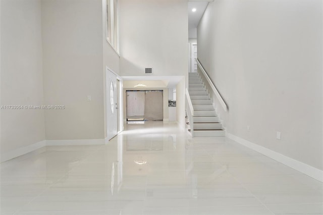 stairway with tile patterned flooring