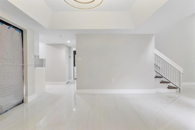 interior space with a tray ceiling