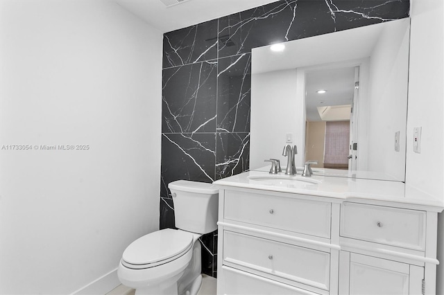 bathroom with vanity and toilet