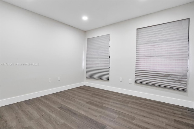 empty room featuring hardwood / wood-style flooring