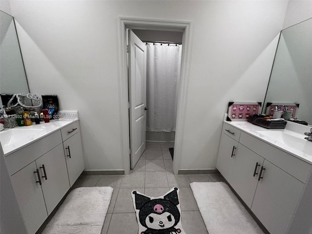 bathroom with tile patterned flooring and vanity