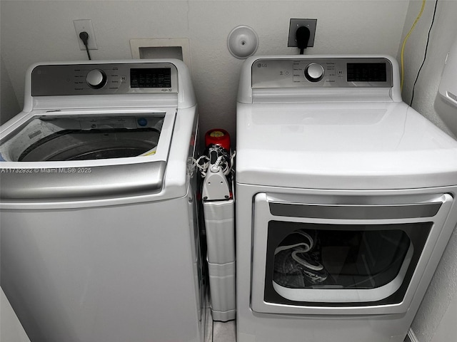 laundry area featuring washer and clothes dryer