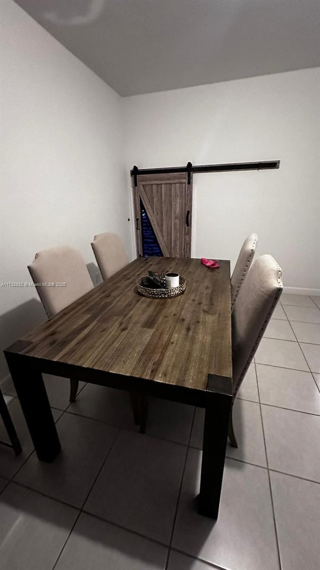 dining area featuring light tile patterned flooring