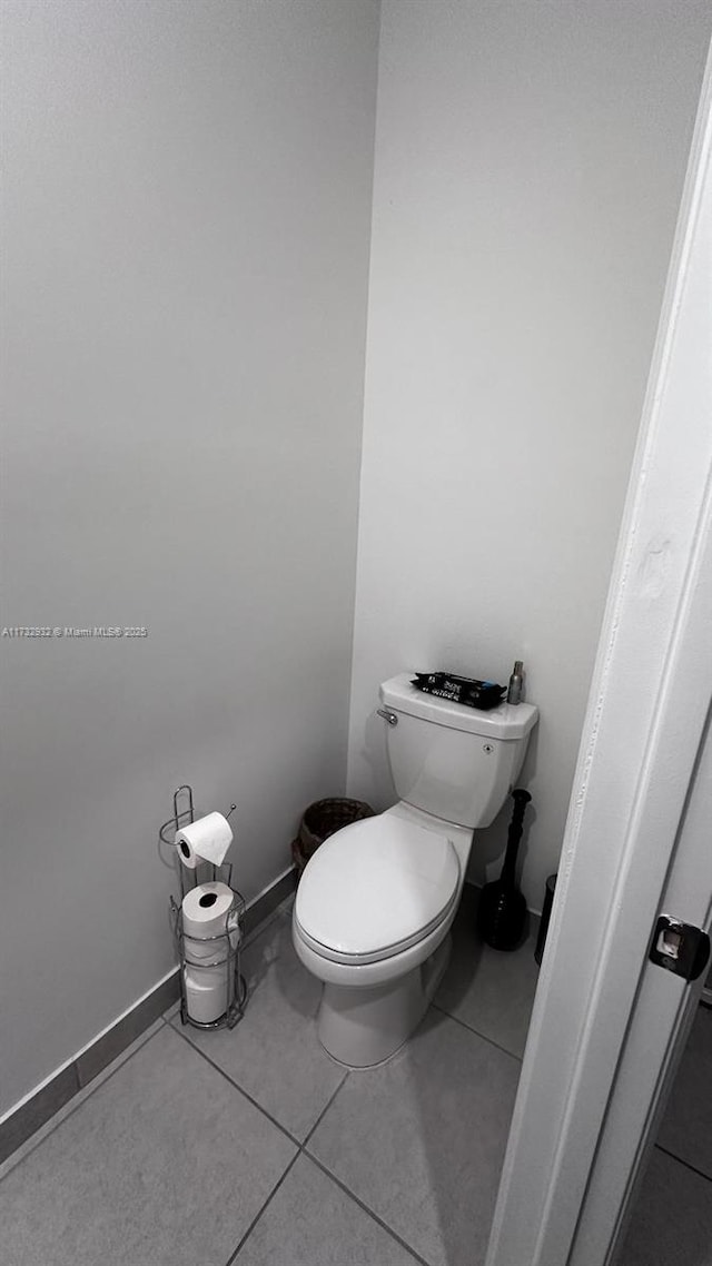 bathroom featuring tile patterned floors and toilet