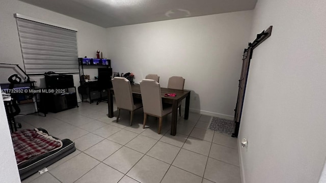 dining area with light tile patterned floors