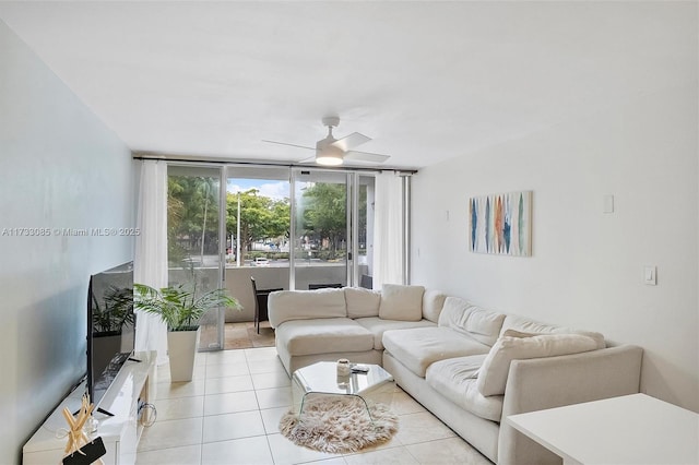 living area featuring light tile patterned floors and a ceiling fan