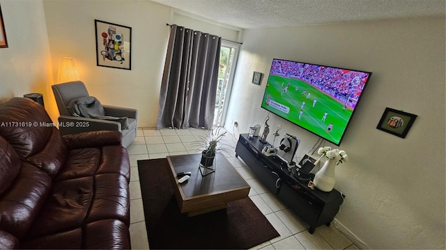 tiled living room featuring a textured ceiling and baseboards