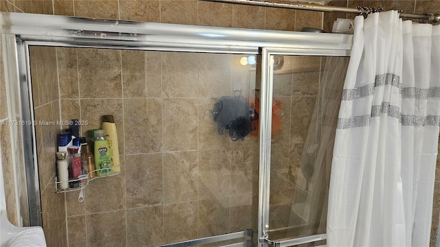 bathroom with a shower stall