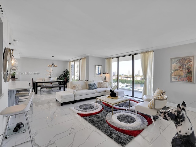 living room featuring floor to ceiling windows and a chandelier