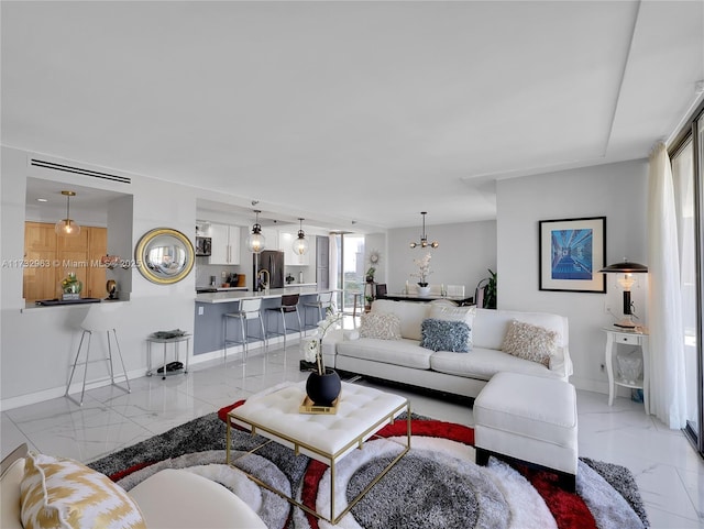 living room with an inviting chandelier