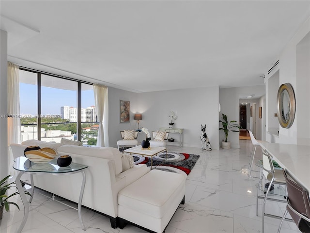 living room featuring a wall of windows