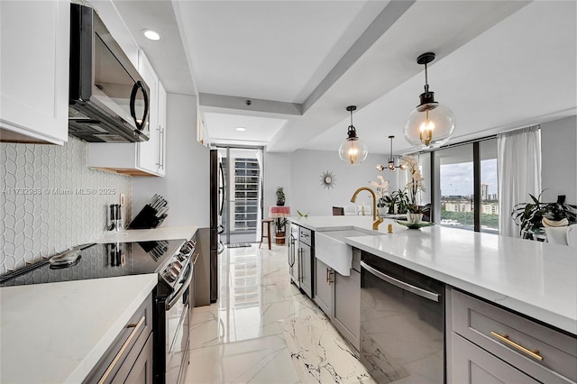 kitchen with range with electric cooktop, white cabinetry, black dishwasher, sink, and hanging light fixtures