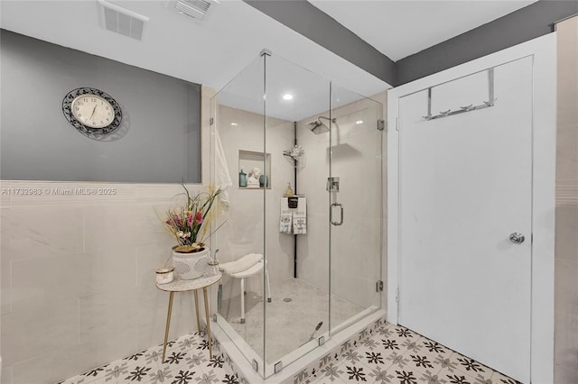 bathroom featuring an enclosed shower