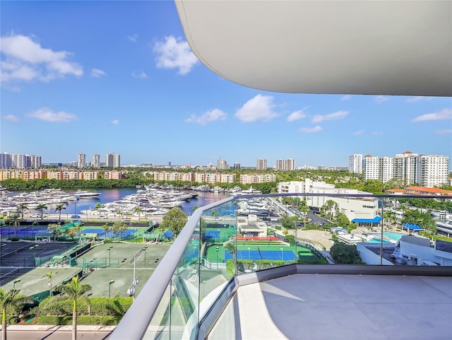 balcony featuring a water view