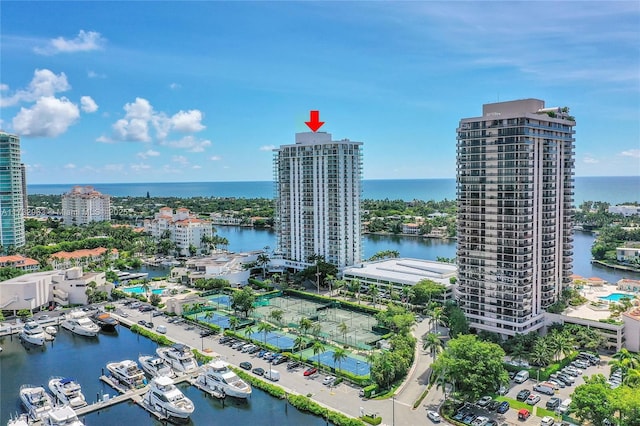 birds eye view of property with a water view