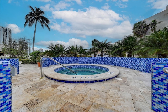 view of pool featuring a patio area and a community hot tub