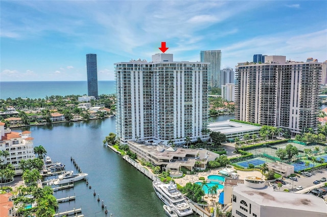 birds eye view of property with a water view