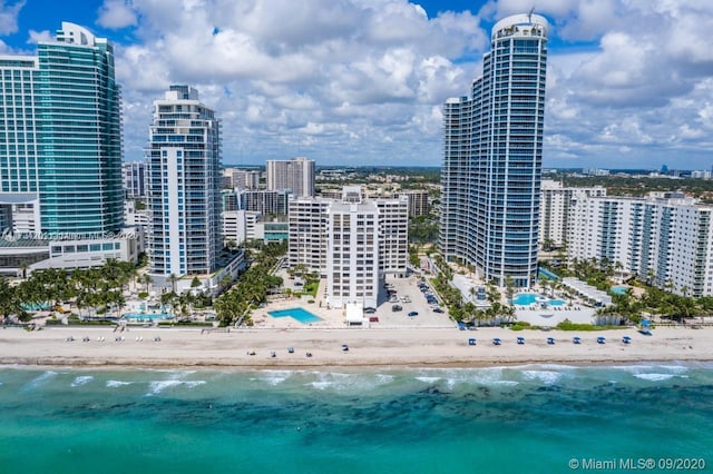 property's view of city featuring a view of the beach and a water view