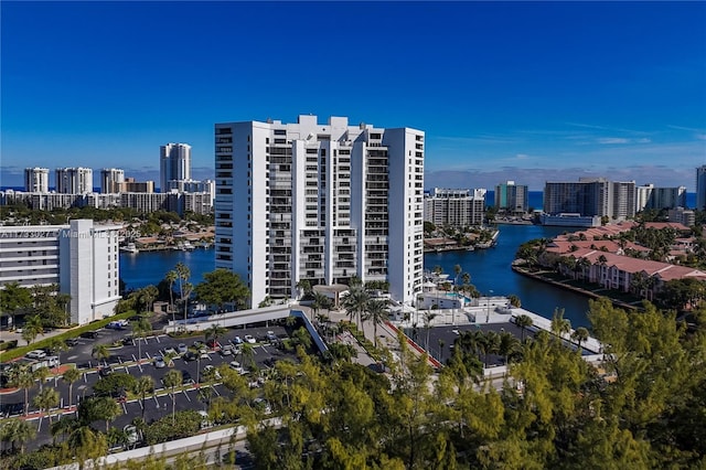 drone / aerial view featuring a water view and a city view