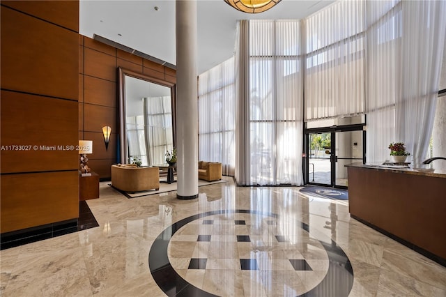 300 Three Islands Blvd Unit 102, Hallandale Beach, FL 33009 - community lobby with a towering ceiling
