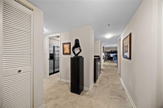 300 Three Islands Blvd Unit 102, Hallandale Beach, FL 33009 - hall featuring baseboards and light marble finish floors