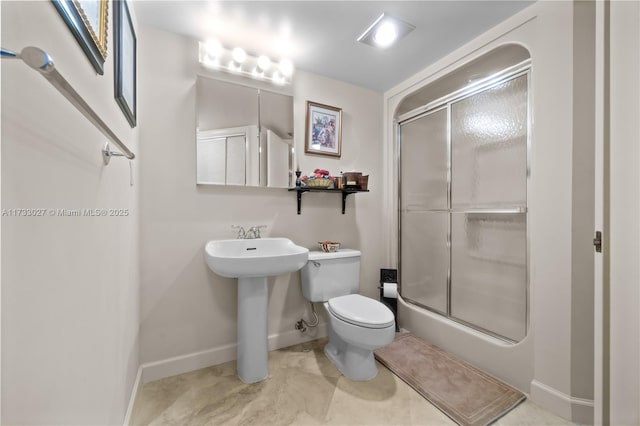 300 Three Islands Blvd Unit 102, Hallandale Beach, FL 33009 - full bathroom featuring a shower with door, baseboards, toilet, and a sink
