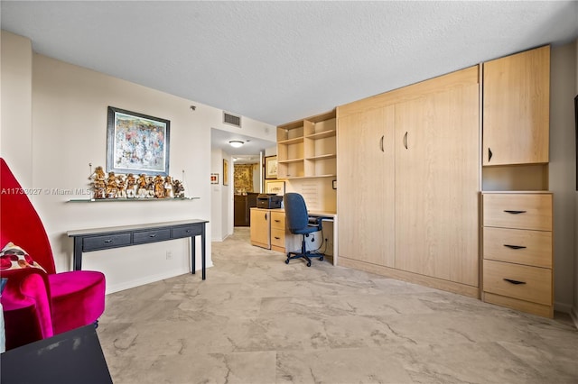 office space featuring a textured ceiling and visible vents