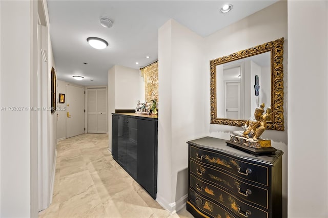 300 Three Islands Blvd Unit 102, Hallandale Beach, FL 33009 - hallway with light marble finish floors and baseboards
