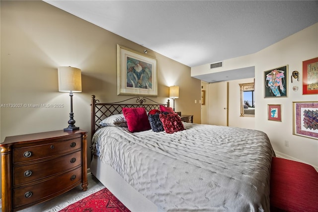 bedroom featuring visible vents