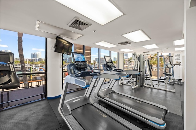 gym with visible vents and floor to ceiling windows