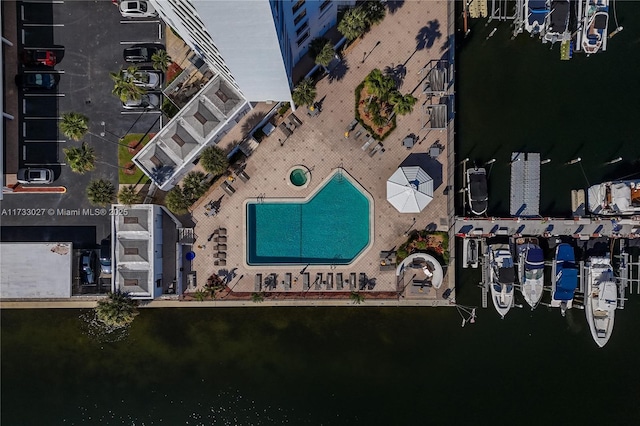 birds eye view of property with a water view