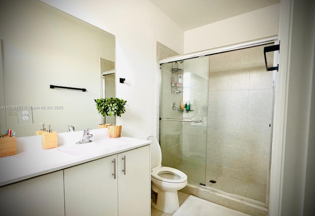 bathroom with vanity, walk in shower, and toilet