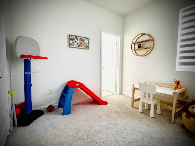 game room with light colored carpet