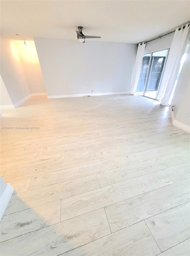 unfurnished room with light wood-type flooring