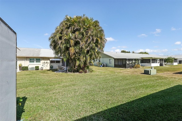 view of yard with a sunroom