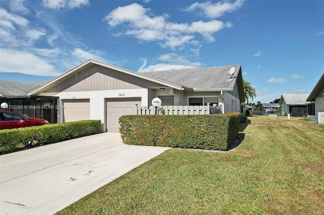 view of front of property with a garage and a front yard