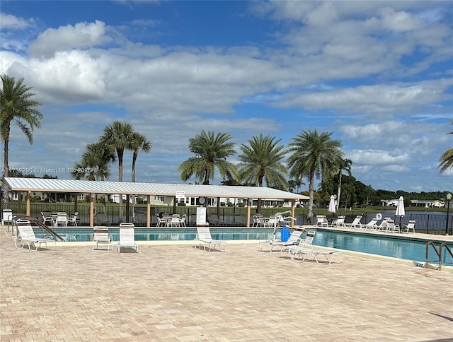 view of swimming pool with a patio area