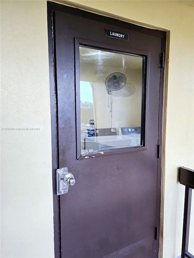 exterior details featuring washing machine and clothes dryer