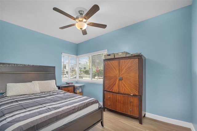 bedroom featuring ceiling fan and light hardwood / wood-style floors