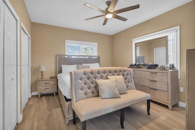 bedroom with light wood-type flooring and ceiling fan