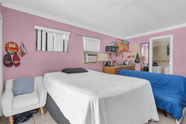 tiled bedroom with crown molding and ensuite bathroom